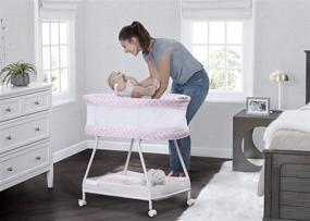 img 2 attached to 👶 Delta Children Sweet Dreams Bassinet with Airflow Mesh: Bedside Portable Crib with Vibration, Lights, Music - Pink Infinity Style