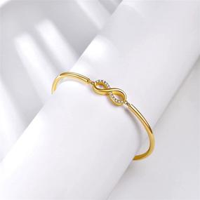 img 1 attached to 🎁 Elegant E 14K Gold Plated Infinity Love Bangles Bracelets: Timeless Womens Adjustable Gold Chain Bangle Bracelet - Ideal Mother's Day Jewelry Gift for Mom, Wife, Daughter, Sisters, Friendship, and Girlfriend