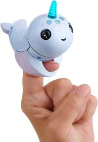 img 4 attached to 🦄 Enhanced SEO: WowWee Fingerlings Light-Up Narwhal Interactive Puppets & Puppet Theaters
