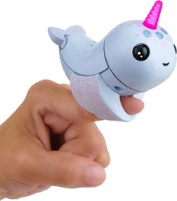 img 3 attached to 🦄 Enhanced SEO: WowWee Fingerlings Light-Up Narwhal Interactive Puppets & Puppet Theaters