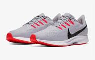 nike pegasus running shoe in gunsmoke grey, white, and gum logo