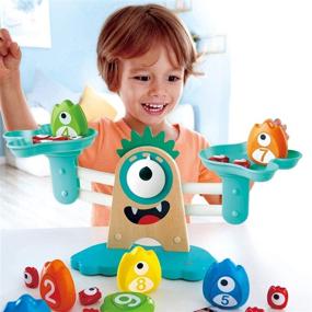 img 1 attached to 📏 Hape Math Monster Scale STEAM Toy, Dimensions: L 15" x W 7.1" x H 5.6