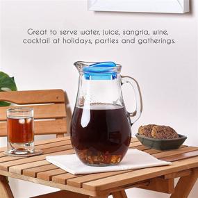 img 2 attached to Classic Glass Water Pitcher with Lid and Spout, 62 oz Capacity - Ideal for Iced Tea, Juice, Water, Soda - With Glass Handle for an Old-Fashioned Beverage Carafe