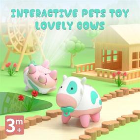 img 3 attached to 🐮 XTOYZ Интерактивные электронные игрушки: Счастливая корова, Робот для обучения STEM с сенсорной чувствительностью, музыкой и аккумулятором для детей и малышей от 3 месяцев+