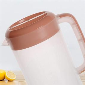img 1 attached to Large 1 Gallon/4L Jucoan Plastic Straining Pitcher - Clear Water Carafe Jug with 2 Strainers, Handles, Measurements - BPA Free - Ideal for Ice Tea and Lemonade Mixing, Juice Dispenser