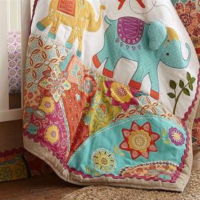 img 2 attached to Levtex Baby Zahara Crib Bed Set - Boho Elephant - 5 Piece Nursery Set with Quilt, Fitted Sheet, Diaper Stacker, Wall Decal & Skirt/Dust Ruffle - Vibrant Orange, Teal, Yellow, Red, Fuchsia Color Palette