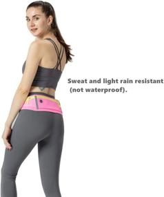 img 2 attached to 🏃 Running-Waist-Belts with Headphone Hole: Securely Fits All Phones Under 6 Inches. Slim & Bounce-free Jogging Belt with Three Zip Pockets, Reflective Strips – Pink Fanny Pack for Workouts & Sports.