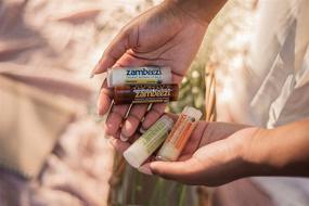 img 2 attached to 🐝 ZAMBEEZI Fair Trade, Organic Beeswax Lip Balm - 4-Pack with Lemongrass, Tangerine, Suncare, and Honeybalm - Ethically Sourced and Effective