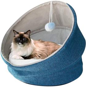 img 4 attached to SAVFOX Cute Cat Bed - Elevated Collapsible Capsule Cave Tent with Covered Design, Self-Heated & Removable Cushion. Machine Washable, Anti-Slip Bottom Bed House with Dangling Cat Toy. Ideal for Kittens, Puppies, and Rabbits (18'' x 18'')