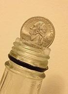 🎩 fascinating bottle magic folding quarter dollar for astonishing coin tricks logo