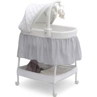 🛏️ delta children smooth glide bedside bassinet - portable crib with activity mobile arm: spinning toys, nightlight & music, silver linings logo