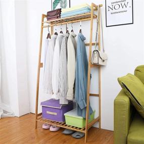 img 3 attached to 👕 Ufine Bamboo Clothes Hanging Rack with 2-Tier Storage Shelves, Coat Hooks & Portable Design - Laundry Closet Organizer and Garment Rack for Bedroom/Guest Room