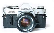 capture timeless moments with the canon ae-1 35mm film camera & 50mm 1:1.8 lens logo