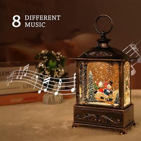 img 1 attached to 🎅 Christmas Snow Globe Lantern with Sparkling Crystals - Perfect for Outdoor Garden and Room Decor, Musical Carols and Blessings (Skiing Snowman)