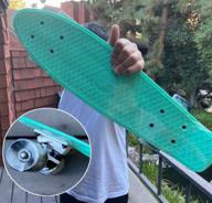 🛹 22-inch teal green mini retro cruiser skateboard with swirl wheels, high-quality abec 7 bearings, durable and reliable, ideal for kids or adults, conveniently fits in your bag, no assembly needed logo