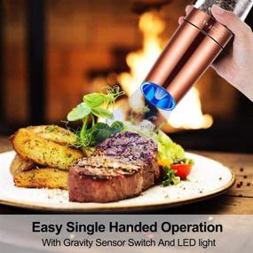 img 3 attached to Adjustable Coarseness Gravity Electric Pepper & Salt Grinder Set with LED Light, One-Handed Automatic Operation, Battery Powered, Stainless Steel Copper, 2 Pack