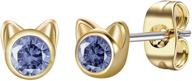 dainty tanzanite earrings december birthstone logo