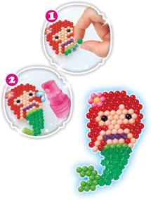 img 1 attached to 👑 Aquabeads Кубик с творчеством Disney Princess: Полный набор бусин - 2,500+ бусин, подставка для дисплея, ремесла для детей | Создайте Бель, Ариэль, Тиану, Рапунцель и не только