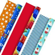 🎁 hallmark reversible wrapping paper bundle - kids birthday with balloons, stars, cupcakes, blue stripes, and solid red patterns - 3 rolls, 75 sq. ft. total logo