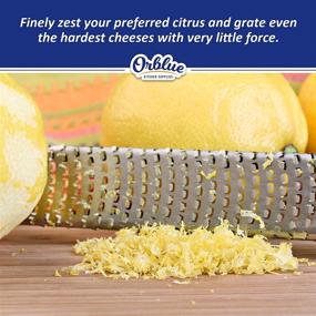 img 2 attached to Orblue Lemon Zester & Cheese Grater - Premium Stainless Steel Grater for Parmesan, Chocolate, Fruits, Vegetables, and More - Protective Cover Included