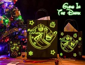 img 2 attached to Набор подарочных пакетов KD KIDPAR Glow in Dark на Рождество - 24 пакета в 4 разных дизайнах (8 больших, 8 средних, 8 маленьких) с 24 бумажными салфетками и 48 ярлыками для подарков - идеально для Рождественской вечеринки.