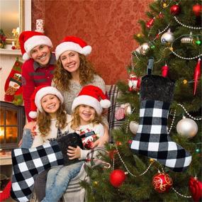 img 3 attached to 🎅 Set of 4 Yoochee Christmas Stockings, 18-inch Large Buffalo Plaid Stockings for Festive Decor, Long-Lasting Red and Black Checked Xmas Stocking (Plush Black Cuff, Black & White)