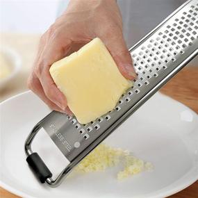 img 2 attached to 🧀 Cheese Grater Zeter: Effortlessly Grate Cheese, Chocolate, Lemon, Ginger, Potato, and more! Razor-Sharp Blade, Comfortable Handle, Plastic Cover & Cleaning Brush Included (Narrow/Wide)