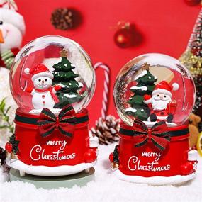 img 2 attached to 🎄 XXMANX 100 MM Christmas Snow Globe with 8 Music and 4 Color Lights - Musical Resin/Glass Home Decoration for Girls Boys Kids Granddaughters Babies Birthday Gift (Automatic Snow Drift)