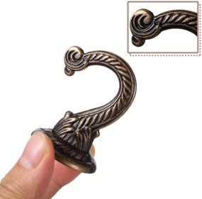 img 1 attached to 6 Pieces Ceiling Hooks Heavy Duty Swag Hook Hanging Plants Chandeliers Wind Chimes Ornament Hooks For Home Office Kitchen (Bronze
