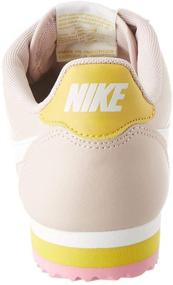 img 2 attached to Ultimate Style and Performance: NIKE Cortez Leather Metallic Silver Men's Athletic Shoes