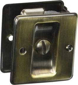 img 1 attached to Schlage Antique Brass Pocket Artisan Sliding Door Lock, 2-1/4 x 1-3/4 Inches, Privacy