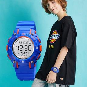 img 2 attached to CakCity Kids Digital Sport Watches: Waterproof LED 7 Color Lights Electronic Wrist Watch for Boys & Girls - Alarm, Stopwatch & More!