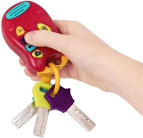 img 3 attached to Игрушечные ключи Battat - мини-фонарик - пульт управления с 4 веселыми звуками - световые и звуковые ключи для младенца, малыша - игрушечные автоключи - от 6 месяцев и старше, красный, 6 x 1.25 x 7.5 дюйма.
