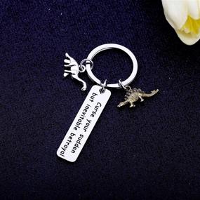 img 2 attached to SEO-Optimized Bobauna Sudden Yet Inevitable Betrayal Inspired Keychain With Dinosaur Charm: Perfect Travel Gift for Dinosaur Lovers