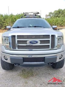img 1 attached to Enhance Your Ford F-150: Mountains2Metal Bullet Holes Bumper Grille Insert - Black Stainless Steel - Compatible with 2009-2014 F-150 - M2M #100-310-1