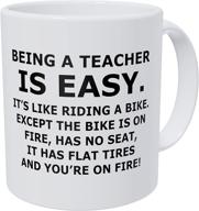 🔥 wampumtuk funny coffee mug: being a teacher is easy, it's like riding a bike on fire - get fired up! logo