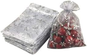 img 4 attached to 🎅 Котозей 100 штук 5x7 дюймов Рождественские шнуровочные органзовые сумочки для украшений и подарков на свадьбу, праздник или Рождество: дизайн со снежинками.