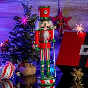 img 2 attached to 🎅 Wooden Peppermint Christmas Nutcracker - Red, White, and Green Glitter Candy Themed Holiday Decor - Toy Soldier Doll Figure for Festive Nut Cracker Decorations