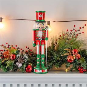 img 1 attached to 🎅 Wooden Peppermint Christmas Nutcracker - Red, White, and Green Glitter Candy Themed Holiday Decor - Toy Soldier Doll Figure for Festive Nut Cracker Decorations