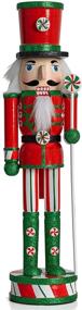 img 4 attached to 🎅 Wooden Peppermint Christmas Nutcracker - Red, White, and Green Glitter Candy Themed Holiday Decor - Toy Soldier Doll Figure for Festive Nut Cracker Decorations