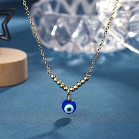 img 1 attached to 💙 Lucky Charms Unleashed: UNGENT THEM 18K Gold Evil Eye Necklace with Brilliant Blue Eye Pendant - A Dainty Jewelry Masterpiece for Women & Girls (Silver/Gold)