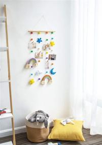 img 2 attached to Dahey Hanging Photo Display with Pom Pom Rainbow Decoration - Cute Wall Hanging Picture Organizer for Boho Home Decor - Collage Picture Frames for Nursery, Baby, Kid's Room, Bedroom, Dorm - Includes 25 Wooden Clips