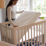 chemical-free lullaby earth breathe safe mini crib mattress: dual-firmness, natural & washable protector included logo