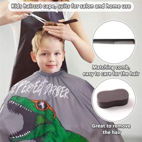 img 2 attached to MHJY Boys Dinosaur Haircut Barber Cape with Sponge Brush and Comb - Adjustable Closure for Kids Hair Cutting Apron