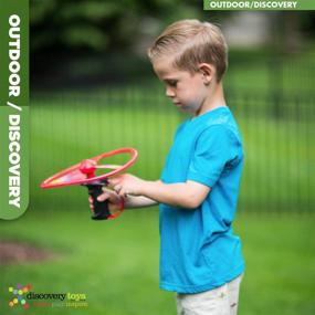 img 1 attached to Explore the Skies with Discovery Toys Sky Spin Flying Aerial Disc Launcher – Engaging STEM Toy for Kids 6 Years and Up