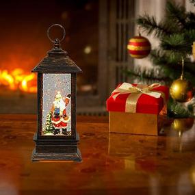 img 2 attached to 🎅 Enchanting Christmas Snow Globe Lantern Decoration: Lighted Water Glittering Snowing Globe Christians Lantern with Santa Claus for Magical Holiday Season Home Decor