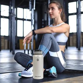 img 2 attached to 🌊 Swig Savvy Sports Water Bottle, 32oz - Vacuum Insulated Stainless Steel, Wide Mouth with 2 Leakproof Lids, Storage Sleeve Included (Beige)