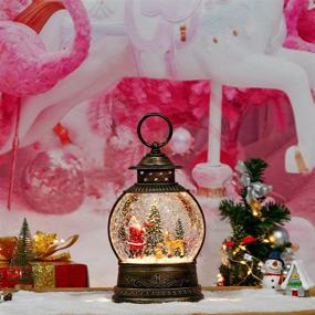 img 1 attached to 🎶 Музыкальный рождественский снежный шар-фонарь с мерцающими огнями - сеть, батарея и USB-питание - с изображением Санты Клауса, елки и лося