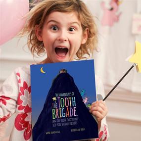 img 2 attached to 🦷 Tooth Brigade Book and Blue Monster Tooth Fairy Pillow Bundle: Interactive Set with 8" Plush Toy, Lost Tooth Pocket, and Adventures of The Tooth Brigade Hardcover Book