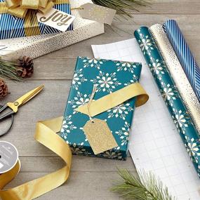 img 3 attached to 🎁 Hallmark Winter Glow: Holographic Holiday Wrapping Paper with Cut Lines on Reverse - Navy Blue, Gold, Holographic Snowflakes (3 Rolls: 80 sq. ft. ttl)